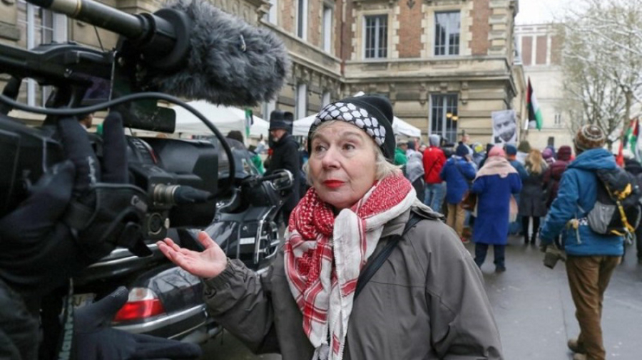 Palestinian rights activist charged with condoning terrorism